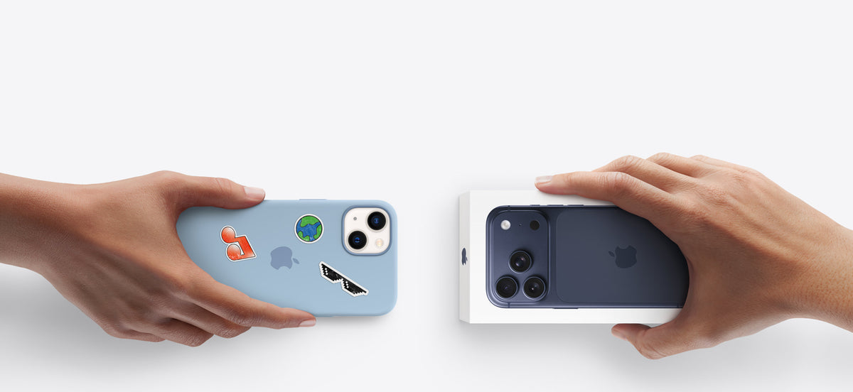 Hands holding iPhone with colorful stickers and new iPhone in box, showcasing phone cases and accessories